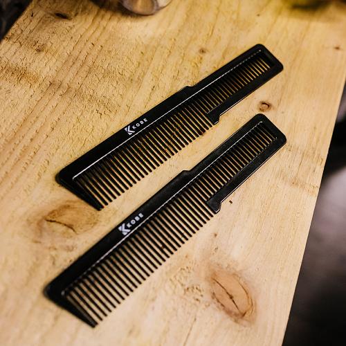 Kobe Carbon Flat Top Clipper Comb Placed on Table