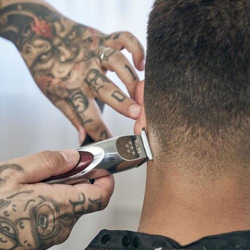 Wahl A Line Trimmer in use on male head back
