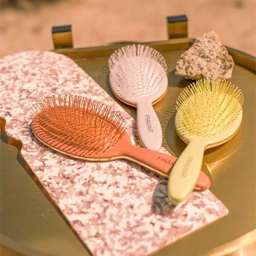 The Framar Golden Hour Detangle brushes pick up the warm colours of the collection's desert vibe.