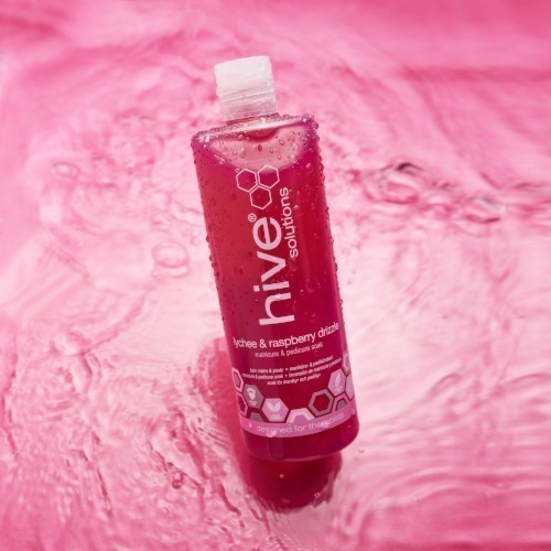 Hive Lychee and Raspberry Drizzle Soak with water background